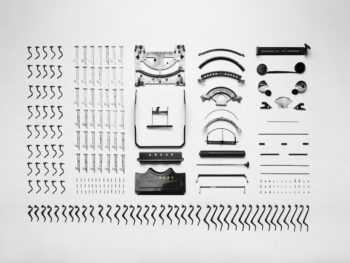 all the parts of a machine (like a brain) laid out on a white background